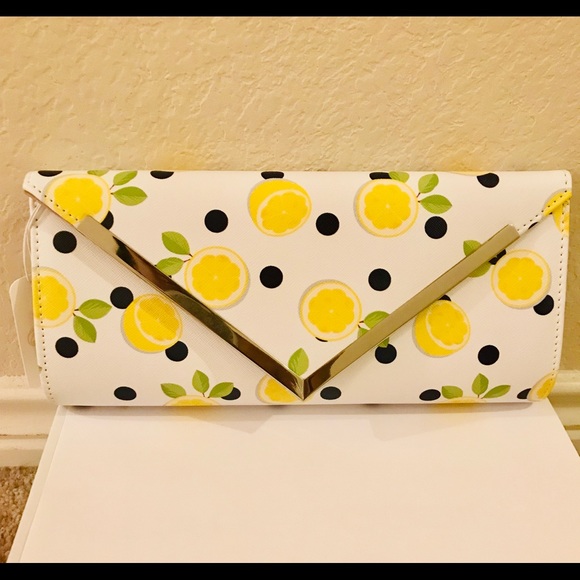 Charming Charlie Handbags - Charming Charlie Stylish Lemon Polka Dot Clutch